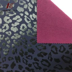 Leopardprint 4-vejs stretchstof bundet med polarfleece